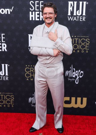 Photo for Pedro Pascal arrives at the 29th Annual Critics' Choice Awards held at The Barker Hangar on January 14, 2024 in Santa Monica, Los Angeles, California, United States - Royalty Free Image