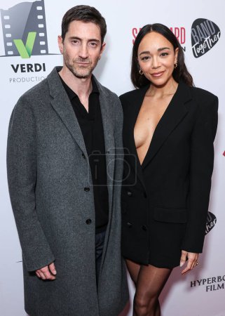 Photo for Iddo Goldberg and wife Ashley Madekwe arrive at the Los Angeles Premiere Of VMI Releasing's 'Junction' held at the Harmony Gold Theater on January 24, 2024 in Hollywood, Los Angeles, California, United States. - Royalty Free Image