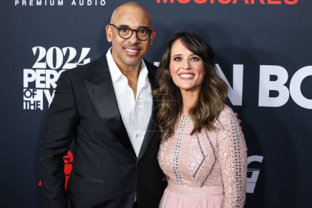 Photo for Harvey Mason Jr. and Laura Segura arrive at the 2024 MusiCares Person of the Year Honoring Jon Bon Jovi held at the Los Angeles Convention Center on February 2, 2024 in Los Angeles, California, United States. - Royalty Free Image