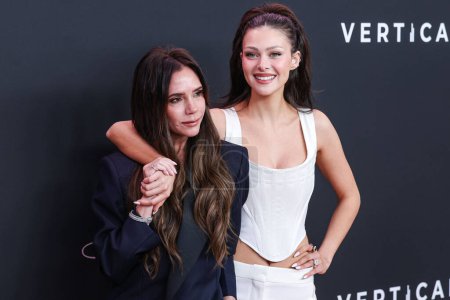 Photo for Victoria Beckham and Nicola Peltz Beckham arrive at the Los Angeles Premiere Of Vertical Entertainment's 'Lola' held at the Regency Bruin Theatre on February 3, 2024 in Westwood, Los Angeles, California, United States. - Royalty Free Image