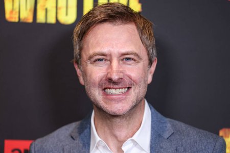 Photo for Chris Hardwick arrives at the Los Angeles Premiere Of AMC+'s 'The Walking Dead: The Ones Who Live' Season 1 held at the Linwood Dunn Theater at the Pickford Center for Motion Picture Study on February 7, 2024 in Hollywood, Los Angeles, California - Royalty Free Image