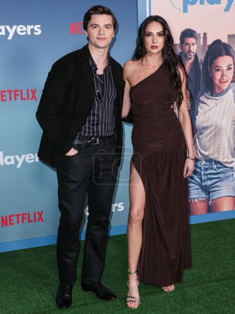 Photo for Joel Courtney and Mia Scholink arrive at the Los Angeles Premiere Of Netflix's 'Players' held at The Egyptian Theatre Hollywood on February 8, 2024 in Hollywood, Los Angeles, California, United States. - Royalty Free Image
