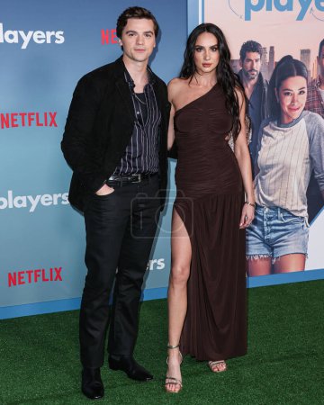 Photo for Joel Courtney and Mia Scholink arrive at the Los Angeles Premiere Of Netflix's 'Players' held at The Egyptian Theatre Hollywood on February 8, 2024 in Hollywood, Los Angeles, California, United States. - Royalty Free Image