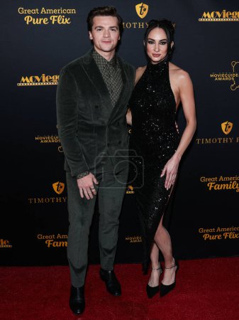 Photo for Joel Courtney and wife Mia Scholink Courtney arrive at the 31st Annual Movieguide Awards Gala held at AVALON Hollywood and Bardot on February 9, 2024 in Hollywood, Los Angeles, California, United States. - Royalty Free Image