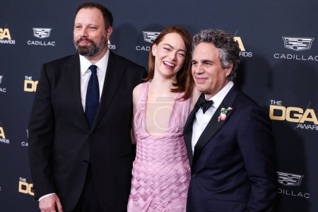 Photo for Yorgos Lanthimos, Emma Stone and Mark Ruffalo arrive at the 76th Annual Directors Guild Of America (DGA) Awards held at The Beverly Hilton Hotel on February 10, 2024 in Beverly Hills, Los Angeles, California, United States. - Royalty Free Image