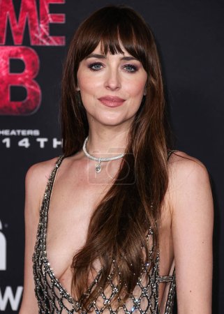 Photo for Dakota Johnson wearing Gucci arrives at the World Premiere Of Columbia Pictures' 'Madame Web' held at the Regency Village Theatre on February 12, 2024 in Westwood, Los Angeles, California, United States. - Royalty Free Image