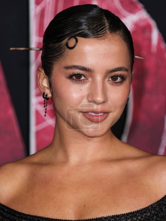 Photo for Isabela Moner Merced wearing an Atelier Versace Couture dress from Tab Vintage arrives at the World Premiere Of Columbia Pictures' 'Madame Web' held at the Regency Village Theatre on February 12, 2024 in Westwood, Los Angeles, California, USA. - Royalty Free Image