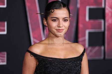 Photo for Isabela Moner Merced wearing an Atelier Versace Couture dress from Tab Vintage arrives at the World Premiere Of Columbia Pictures' 'Madame Web' held at the Regency Village Theatre on February 12, 2024 in Westwood, Los Angeles, California, USA. - Royalty Free Image