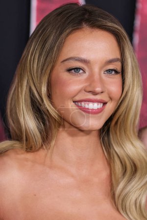 Photo for Sydney Sweeney wearing Oscar de la Renta with Fred Leighton jewelry arrives at the World Premiere Of Columbia Pictures' 'Madame Web' held at the Regency Village Theatre on February 12, 2024 in Westwood, Los Angeles, California, United States. - Royalty Free Image