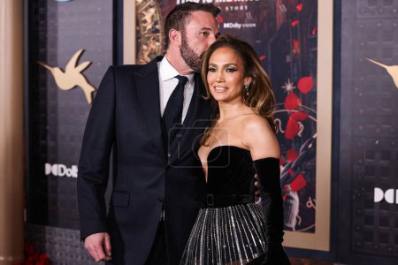 Photo for Ben Affleck and wife Jennifer Lopez (JLo) wearing a Zuhair Murad Couture gown with Joseph Saidian and Sons vintage Van Cleef & Arpels diamond earrings and A.Jaffe diamond rings arrive at the Los Angeles Premiere Of Amazon MGM Studios' 'This Is Me - Royalty Free Image