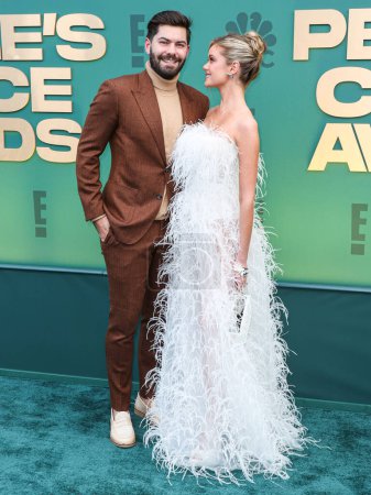 Photo for Dylan Barbour and wife Hannah Godwin arrive at the 49th Annual People's Choice Awards 2024 held at The Barker Hangar on February 18, 2024 in Santa Monica, Los Angeles, California, United States. - Royalty Free Image