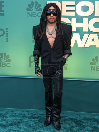 Photo for Lenny Kravitz wearing a Balenciaga blazer, Chrome Hearts jewelry, and Rick Owens glasses arrives at the 49th Annual People's Choice Awards 2024 held at The Barker Hangar on February 18, 2024 in Santa Monica, Los Angeles, California, United States. - Royalty Free Image