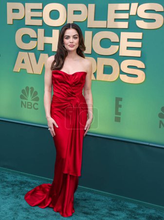Photo for Lucy Hale wearing a Dior dress, Jimmy Choo shoes and Simon G jewelry arrives at the 49th Annual People's Choice Awards 2024 held at The Barker Hangar on February 18, 2024 in Santa Monica, Los Angeles, California, United States - Royalty Free Image