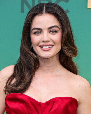 Photo for Lucy Hale wearing a Dior dress, Jimmy Choo shoes and Simon G jewelry arrives at the 49th Annual People's Choice Awards 2024 held at The Barker Hangar on February 18, 2024 in Santa Monica, Los Angeles, California, United States - Royalty Free Image