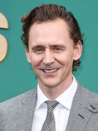 Photo for Tom Hiddleston wearing Ralph Lauren arrives at the 49th Annual People's Choice Awards 2024 held at The Barker Hangar on February 18, 2024 in Santa Monica, Los Angeles, California, United States. - Royalty Free Image