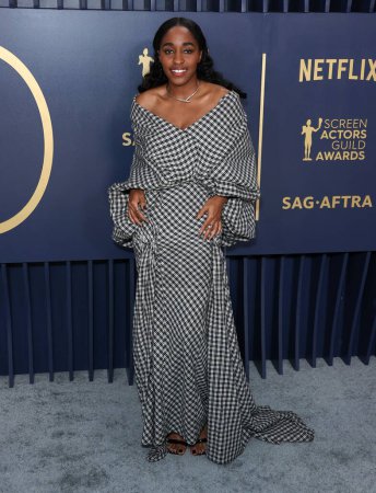 Photo for Ayo Edebiri wearing a Luar look with Tabayer jewelry arrives at the 30th Annual Screen Actors Guild Awards held at the Shrine Auditorium and Expo Hall on February 24, 2024 in Los Angeles, California, United States. - Royalty Free Image