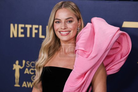 Photo for Margot Robbie wearing Schiaparelli FW20 Couture arrives at the 30th Annual Screen Actors Guild Awards held at the Shrine Auditorium and Expo Hall on February 24, 2024 in Los Angeles, California, United States. - Royalty Free Image