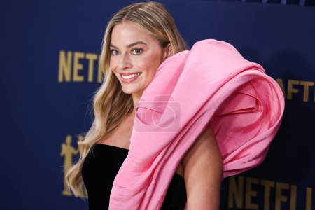 Photo for Margot Robbie wearing Schiaparelli FW20 Couture arrives at the 30th Annual Screen Actors Guild Awards held at the Shrine Auditorium and Expo Hall on February 24, 2024 in Los Angeles, California, United States. - Royalty Free Image