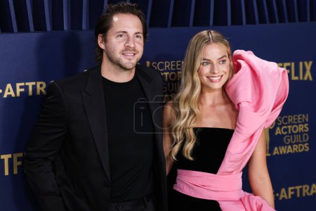 Photo for Tom Ackerley and wife Margot Robbie arrive at the 30th Annual Screen Actors Guild Awards held at the Shrine Auditorium and Expo Hall on February 24, 2024 in Los Angeles, California, United States. - Royalty Free Image
