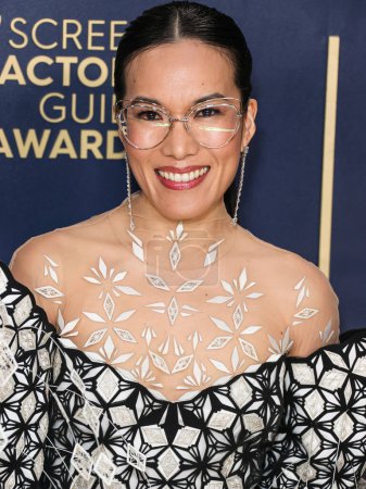 Photo for Ali Wong wearing an Iris Van Herpen Couture dress and Brandon Blackwood shoes arrives at the 30th Annual Screen Actors Guild Awards held at the Shrine Auditorium and Expo Hall on February 24, 2024 in Los Angeles, California, United States. - Royalty Free Image