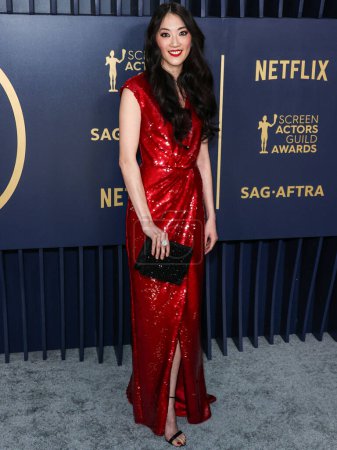 Photo for Clara Wong wearing an Iris Van Herpen Couture dress and Brandon Blackwood shoes arrives at the 30th Annual Screen Actors Guild Awards held at the Shrine Auditorium and Expo Hall on February 24, 2024 in Los Angeles, California, United States. - Royalty Free Image