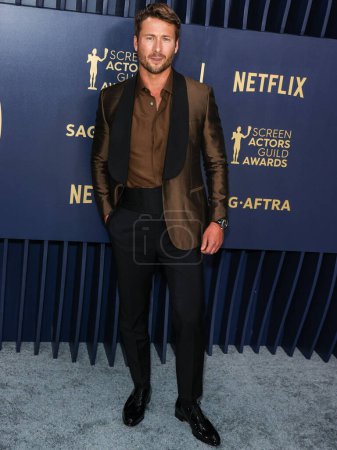 Photo for Glen Powell wearing Brioni arrives at the 30th Annual Screen Actors Guild Awards held at the Shrine Auditorium and Expo Hall on February 24, 2024 in Los Angeles, California, United States. - Royalty Free Image