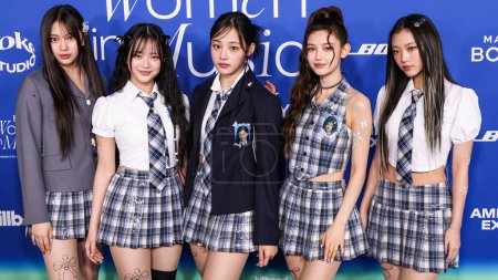 Photo for Hyein, Hanni Pham, Minji, Danielle Marsh and Haerin of South Korean girl group NewJeans arrive at the 2024 Billboard Women In Music held at the YouTube Theater at SoFi Stadium on March 6, 2024 in Inglewood, Los Angeles, California, United States. - Royalty Free Image
