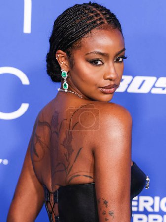 Photo for Justine Skye arrive at the 2024 Billboard Women In Music held at the YouTube Theater at SoFi Stadium on March 6, 2024 in Inglewood, Los Angeles, California, United States. - Royalty Free Image