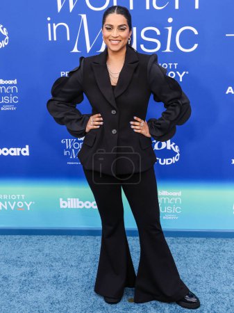 Photo for Lilly Singh arrives at the 2024 Billboard Women In Music held at the YouTube Theater at SoFi Stadium on March 6, 2024 in Inglewood, Los Angeles, California, United States. - Royalty Free Image