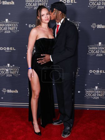 Téléchargez les photos : Angelica Streetman et son petit ami Myles O'Neal arrivent à l'Oscar Party 2024 de Darren Dzienciol dans une résidence privée le 8 mars 2024 à Bel Air, Los Angeles, Californie, États-Unis. - en image libre de droit