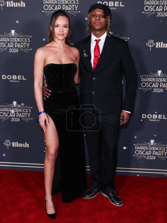 Photo for Angelica Streetman and boyfriend Myles O'Neal arrive at Darren Dzienciol's Oscar Party 2024 held at a Private Residence on March 8, 2024 in Bel Air, Los Angeles, California, United States. - Royalty Free Image