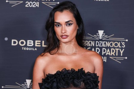 Photo for Gizele Oliveira arrives at Darren Dzienciol's Oscar Party 2024 held at a Private Residence on March 8, 2024 in Bel Air, Los Angeles, California, United States. - Royalty Free Image