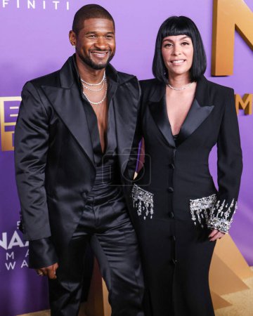 Photo for Usher Raymond IV and girlfriend Jennifer Goicoechea arrive at the 55th Annual NAACP Image Awards held at the Shrine Auditorium and Expo Hall on March 16, 2024 in Los Angeles, California, United States. - Royalty Free Image