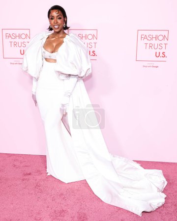 Photo for Kelly Rowland wearing a Harbison Studio gown arrives at the Fashion Trust U.S. Awards 2024 held at a Private Residence on April 9, 2024 in Beverly Hills, Los Angeles, California, United States. - Royalty Free Image