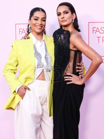 Photo for Lilly Singh and Poorna Jagannathan arrive at the Fashion Trust U.S. Awards 2024 held at a Private Residence on April 9, 2024 in Beverly Hills, Los Angeles, California, United States. - Royalty Free Image