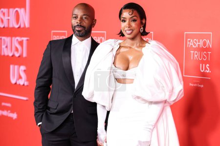 Photo for Tim Weatherspoon and wife Kelly Rowland arrive at the Fashion Trust U.S. Awards 2024 held at a Private Residence on April 9, 2024 in Beverly Hills, Los Angeles, California, United States. - Royalty Free Image
