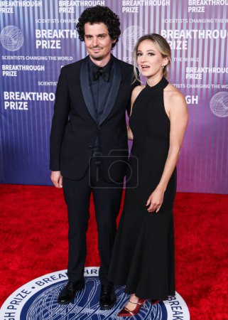 Photo for Damien Chazelle and wife Olivia Hamilton arrive at the 10th Annual Breakthrough Prize Ceremony held at the Academy Museum of Motion Pictures on April 13, 2024 in Los Angeles, California, United States. - Royalty Free Image