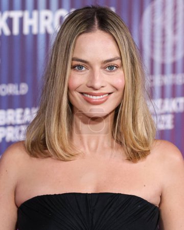 Photo for Margot Robbie wearing Rick Owens SS24 RTW and Jennifer Meyer jewels arrives at the 10th Annual Breakthrough Prize Ceremony held at the Academy Museum of Motion Pictures on April 13, 2024 in Los Angeles, California, United States. - Royalty Free Image