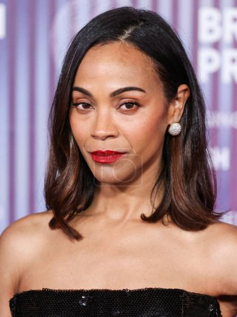 Photo for Zoe Saldana arrives at the 10th Annual Breakthrough Prize Ceremony held at the Academy Museum of Motion Pictures on April 13, 2024 in Los Angeles, California, United States. - Royalty Free Image