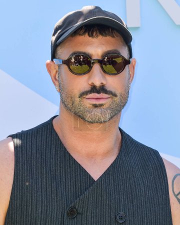 Photo for Adam Drawas arrives at the 7th Annual REVOLVE Festival 2024 during the 2024 Coachella Valley Music And Arts Festival - Weekend 1 - Day 2 held at the Parker Palm Springs Hotel on April 13, 2024 in Palm Springs, Riverside County, California, USA. - Royalty Free Image