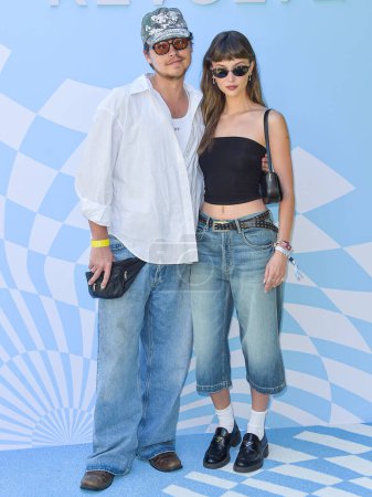 Photo for Cole Sprouse and girlfriend Ari Fournier arrive at the 7th Annual REVOLVE Festival 2024 during the 2024 Coachella Valley Music And Arts Festival - Weekend 1 - Day 2 held at the Parker Palm Springs Hotel on April 13, 2024 in Palm Springs, USA. - Royalty Free Image