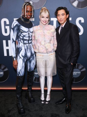 Photo for Austin Crute, Lucy Boynton and Justin H. Min arrive at the Los Angeles Premiere Of Searchlight Pictures' 'The Greatest Hits' held at the El Capitan Theatre on April 15, 2024 in Hollywood, Los Angeles, California, United States. - Royalty Free Image