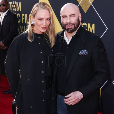 Photo for Uma Thurman and John Travolta arrive at the 15th Annual TCM Classic Film Festival 2024 Opening Night And 30th Anniversary Presentation Of Miramax's 'Pulp Fiction' held at the TCL Chinese Theatre on April 18, 2024 in Hollywood, Los Angeles, California - Royalty Free Image
