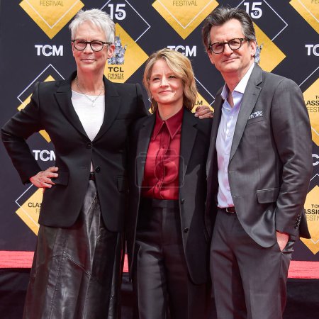 Photo for Jamie Lee Curtis, Jodie Foster and Ben Mankiewicz attend the 15th Annual TCM Classic Film Festival 2024 - TCM Hosts Handprint And Footprint Ceremony Honoring Jodie Foster held at the TCL Chinese Theatre IMAX Forecourt on April 19, 2024 in Hollywood - Royalty Free Image