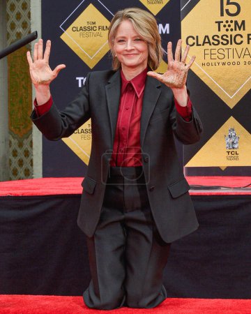Photo for Jodie Foster signs her autograph in cement during the 15th Annual TCM Classic Film Festival 2024 - TCM Hosts Handprint And Footprint Ceremony Honoring Jodie Foster held at TCL Chinese Theatre IMAX Forecourt on April 19, 2024 in Los Angeles - Royalty Free Image