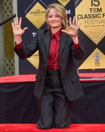 Photo for Jodie Foster signs her autograph in cement during the 15th Annual TCM Classic Film Festival 2024 - TCM Hosts Handprint And Footprint Ceremony Honoring Jodie Foster held at TCL Chinese Theatre IMAX Forecourt on April 19, 2024 in Los Angeles - Royalty Free Image