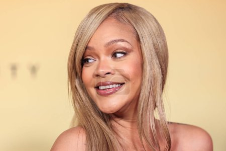 Photo for Rihanna (Robyn Rihanna Fenty) arrives at the Rihanna x Fenty Beauty New Product Launch For Fenty Beauty Soft'Lit Naturally Luminous Longwear Foundation held at 7th Street Studios on April 26, 2024 in Los Angeles, California, United States. - Royalty Free Image