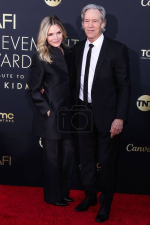 Photo for Michelle Pfeiffer and husband David E. Kelley arrive at the 49th Annual AFI (American Film Institute) Lifetime Achievement Award Gala Tribute Celebrating Nicole Kidman held at the Dolby Theatre on April 27, 2024 in Hollywood, Los Angeles, California - Royalty Free Image