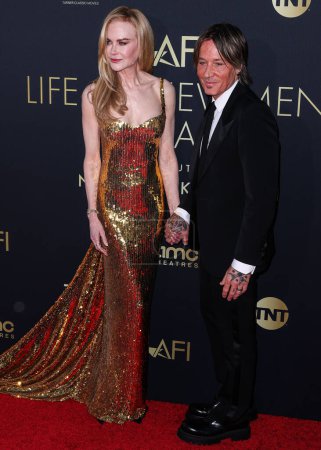 Photo for Nicole Kidman and husband Keith Urban arrive at the 49th Annual AFI (American Film Institute) Lifetime Achievement Award Gala Tribute Celebrating Nicole Kidman held at the Dolby Theatre on April 27, 2024 in Hollywood, Los Angeles, California - Royalty Free Image