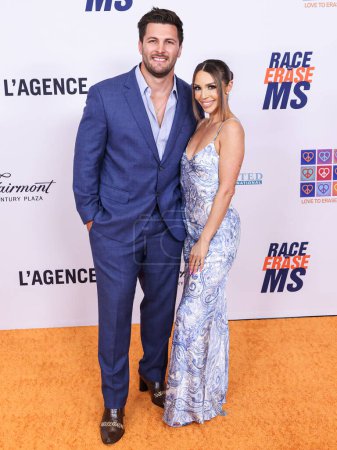 Photo for Brock Davies and wife Scheana Shay arrive at the 31st Annual Race To Erase MS Gala 2024 held at the Fairmont Century Plaza on May 10, 2024 in Century City, Los Angeles, California, United States. - Royalty Free Image